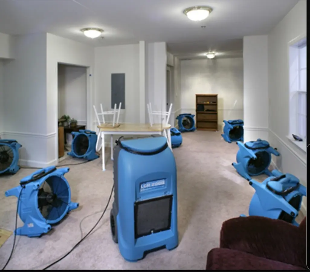 Air movers and dehumidifier setup for Water Damage Restoration in Maili